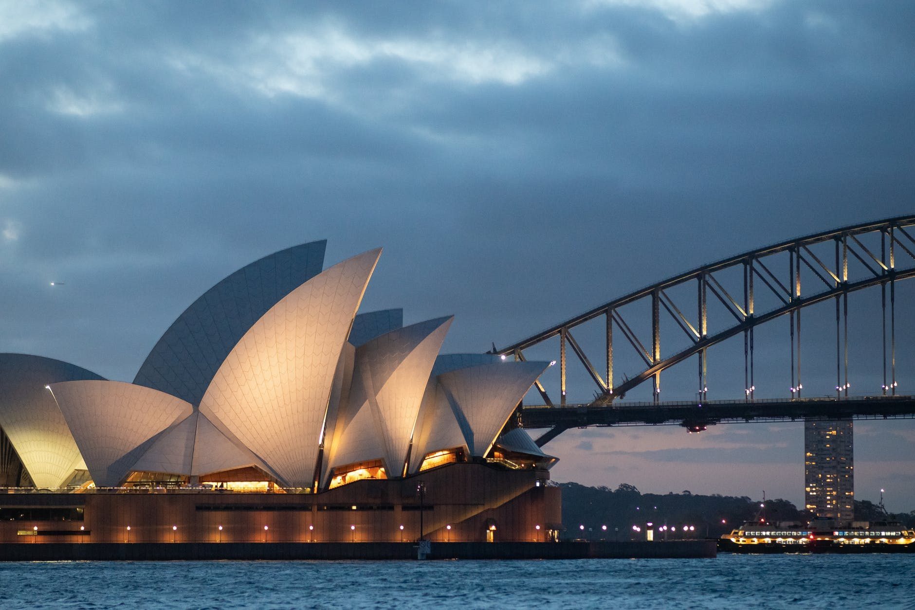 exterior of sydney opera house in late evening